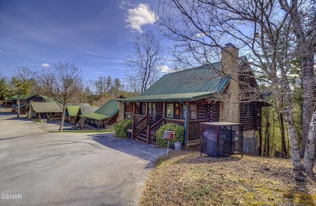 cabin featuring a porch