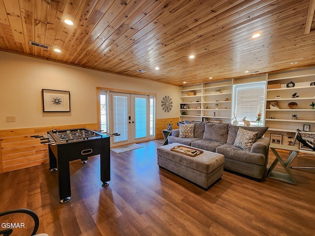 rec room featuring visible vents, built in shelves, french doors, wooden ceiling, and wainscoting