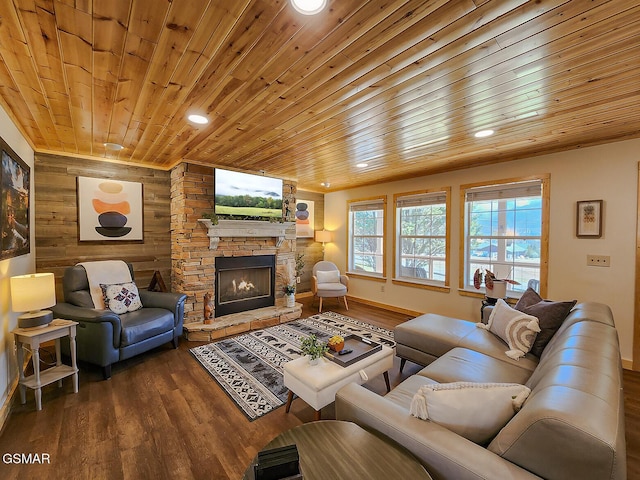 living area with wooden walls, recessed lighting, wooden ceiling, a fireplace, and dark wood-style flooring