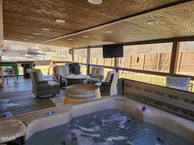 exterior space featuring wooden ceiling and a jacuzzi