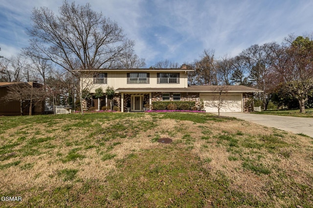 traditional-style home with brick siding, a front lawn, a chimney, a garage, and driveway