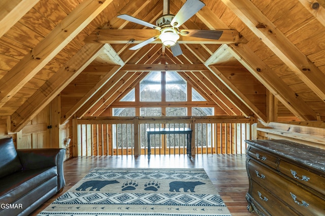 unfurnished living room featuring vaulted ceiling with beams, wood ceiling, ceiling fan, and wood finished floors