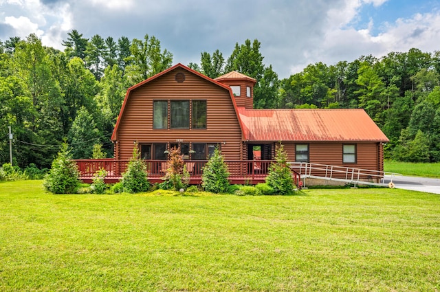 log cabin with a front yard