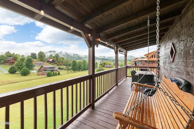 deck featuring a lawn