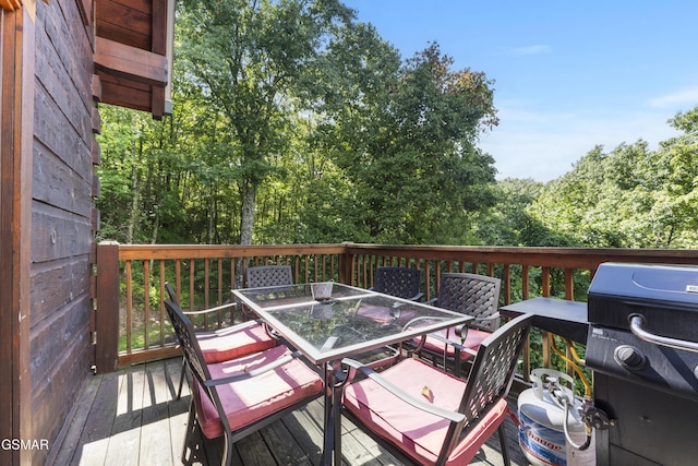 1251 Bear Cub Way, Gatlinburg, TN 37738 - wooden deck featuring grilling area and outdoor dining space