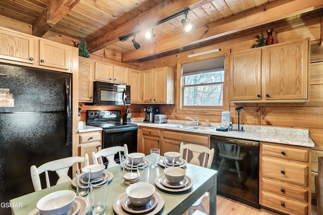 2904 Peregrine Way, Pigeon Forge, TN 37863 - kitchen featuring black appliances, a wooden ceiling with exposed beams, light countertops, light brown cabinetry, and light wood-type flooring