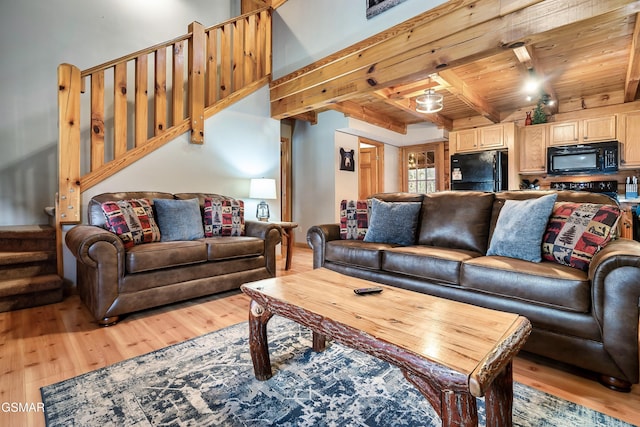 2904 Peregrine Way, Pigeon Forge, TN 37863 - living area with light wood-type flooring, stairway, and a wooden ceiling with exposed beams