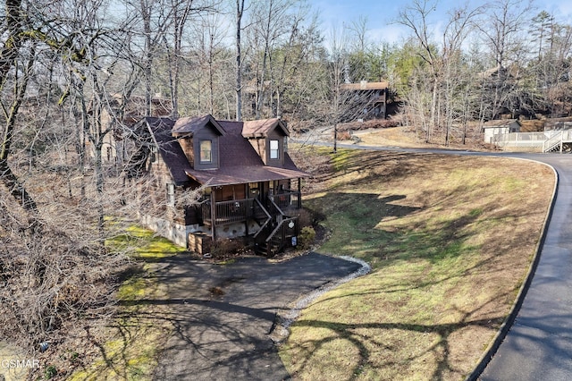 2904 Peregrine Way, Pigeon Forge, TN 37863 - view of front facade featuring covered porch, stairs, and a front yard