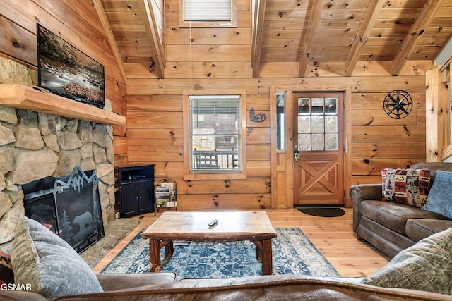 2904 Peregrine Way, Pigeon Forge, TN 37863 - living room with wood ceiling, hardwood / wood-style flooring, wood walls, and a stone fireplace