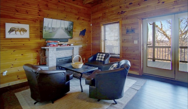 3831 Glenview Way, Sevierville, TN 37862 - living room featuring a fireplace, wood walls, and wood finished floors