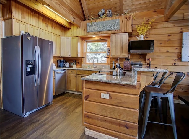 3831 Glenview Way, Sevierville, TN 37862 - kitchen with appliances with stainless steel finishes, wooden walls, dark wood-style flooring, wooden ceiling, and light stone countertops