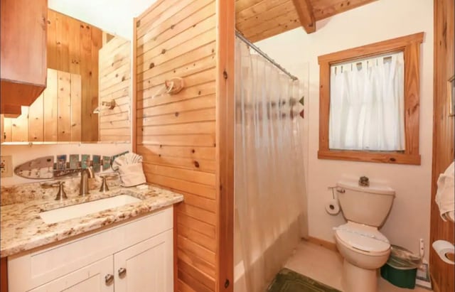 3831 Glenview Way, Sevierville, TN 37862 - bathroom featuring vanity, shower / bath combo, beam ceiling, wooden walls, and tile patterned flooring