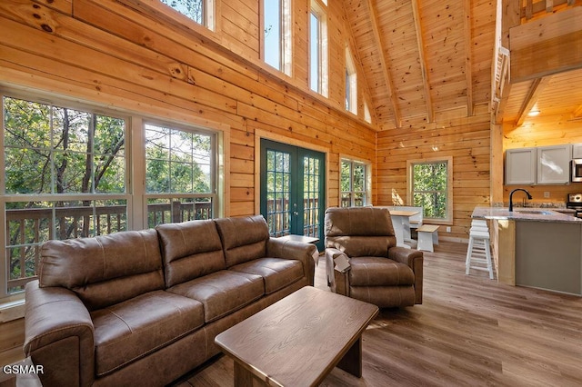 833 Park Dr, Gatlinburg, TN 37738 - living area with wood ceiling, french doors, and wooden walls
