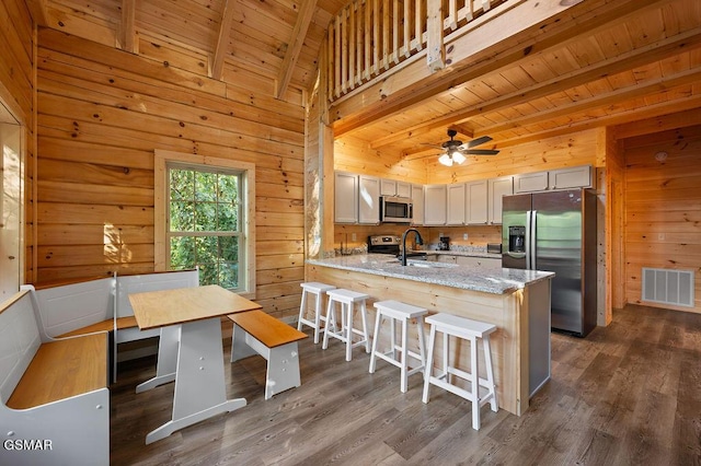 833 Park Dr, Gatlinburg, TN 37738 - kitchen featuring beamed ceiling, visible vents, wooden ceiling, and appliances with stainless steel finishes