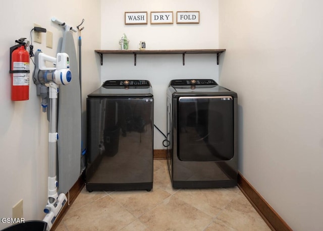 laundry area with washing machine and dryer