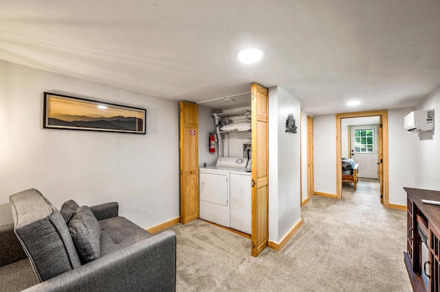 washroom with washer and clothes dryer, light carpet, and a wall mounted AC