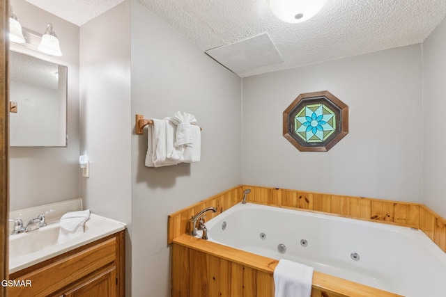 2108 Redmond Way, Sevierville, TN 37876 - full bathroom featuring a textured ceiling, a tub with jets, and vanity