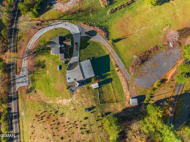 birds eye view of property featuring a rural view