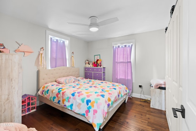 bedroom with ceiling fan and dark wood-type flooring