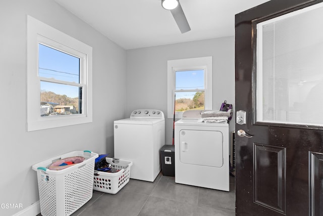 clothes washing area with washer and clothes dryer, ceiling fan, and tile patterned floors