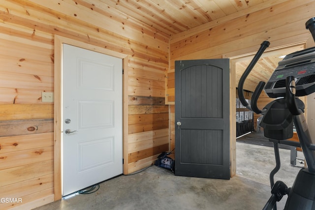 exercise room with wood walls