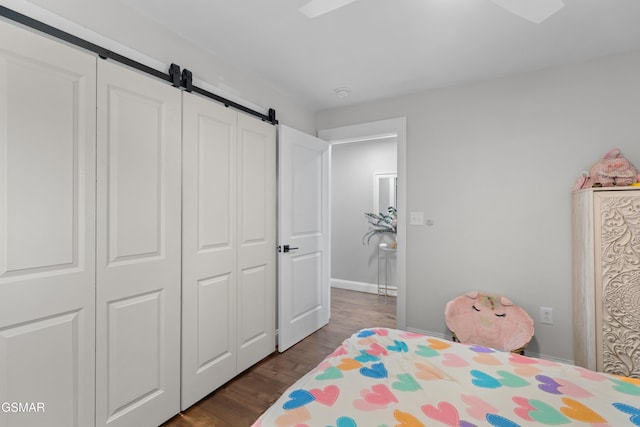 bedroom featuring a closet and dark hardwood / wood-style floors