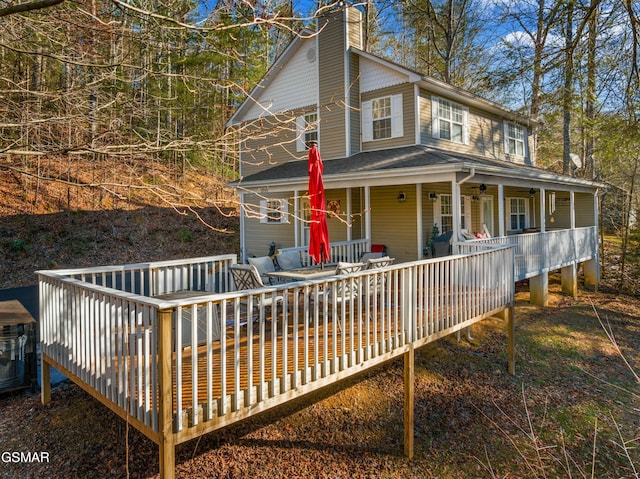 exterior space featuring a deck and covered porch