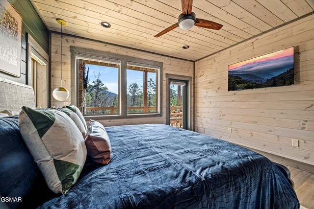 bedroom with ceiling fan, recessed lighting, wooden walls, wood finished floors, and wood ceiling