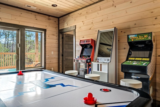 game room with wooden ceiling, visible vents, and wood walls