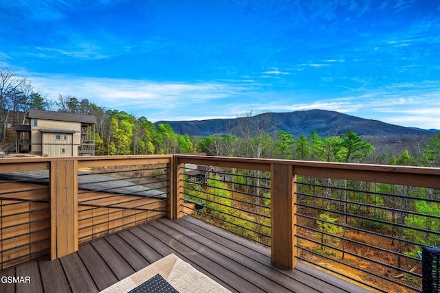 wooden deck featuring a mountain view