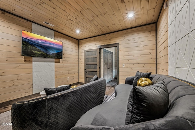 cinema room featuring recessed lighting, wood finished floors, wood ceiling, and wooden walls