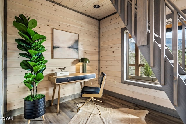 office space featuring wooden ceiling, wood finished floors, and wooden walls