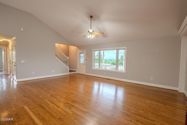 1110 Hide Away Ln, Kodak, TN 37764 - unfurnished living room featuring stairs, a ceiling fan, lofted ceiling, and wood finished floors