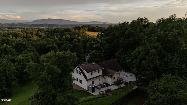 1110 Hide Away Ln, Kodak, TN 37764 - aerial view of property and surrounding area featuring a heavily wooded area and a mountain backdrop