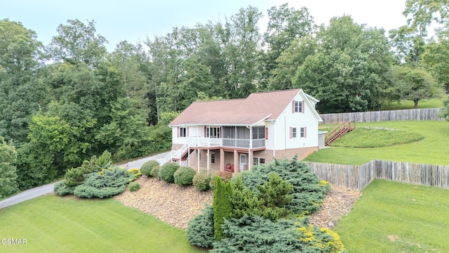 1110 Hide Away Ln, Kodak, TN 37764 - view of front of house with stairs, a fenced backyard, a deck, and brick siding