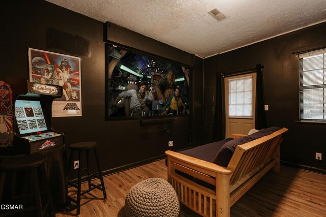 1730 Red Fox Ridge Way, Sevierville, TN 37862 - home theater with a textured ceiling and wood finished floors