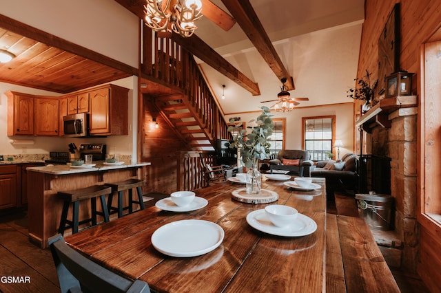 1730 Red Fox Ridge Way, Sevierville, TN 37862 - dining space with stairway, beam ceiling, dark wood-type flooring, ceiling fan, and a chandelier