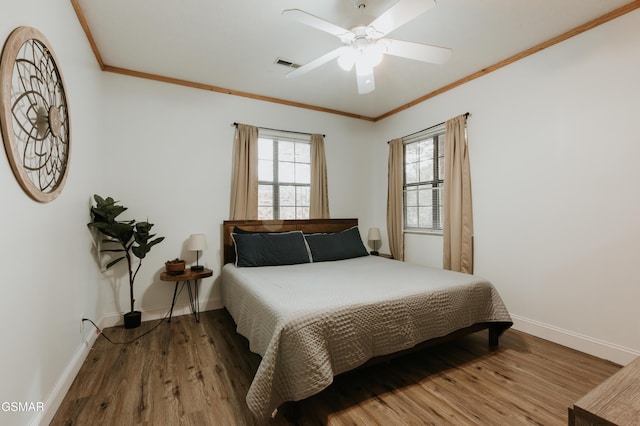 1730 Red Fox Ridge Way, Sevierville, TN 37862 - bedroom with crown molding, wood finished floors, and a ceiling fan