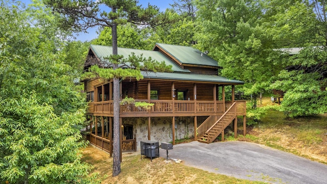 view of front of home featuring central air condition unit and a wooden deck