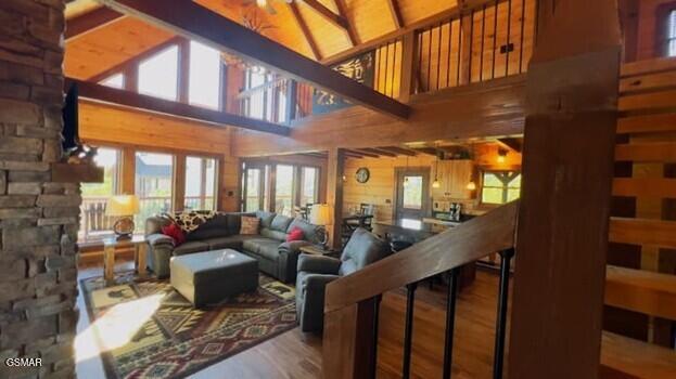 710 Village Loop Rd, Gatlinburg, TN 37738 - living area with wood finished floors, wood walls, and a high ceiling