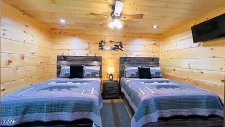 710 Village Loop Rd, Gatlinburg, TN 37738 - bedroom with wooden ceiling, wooden walls, and recessed lighting