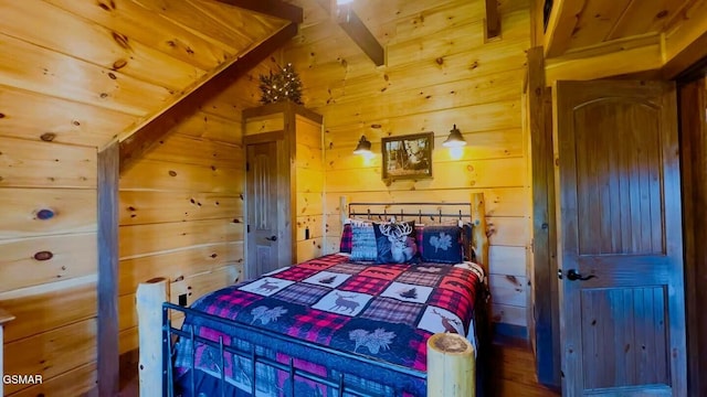 710 Village Loop Rd, Gatlinburg, TN 37738 - bedroom featuring wood walls and vaulted ceiling