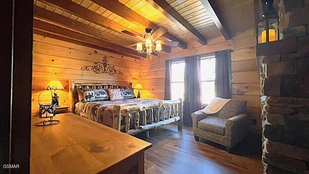 710 Village Loop Rd, Gatlinburg, TN 37738 - bedroom featuring wood walls, wood ceiling with exposed beams, and wood finished floors