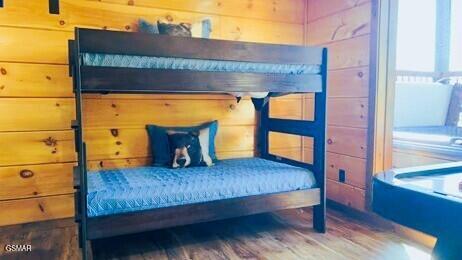 710 Village Loop Rd, Gatlinburg, TN 37738 - bedroom with wood finished floors and wooden walls