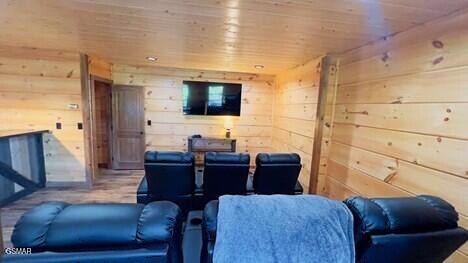 710 Village Loop Rd, Gatlinburg, TN 37738 - home theater room featuring wood ceiling, wood walls, and wood finished floors
