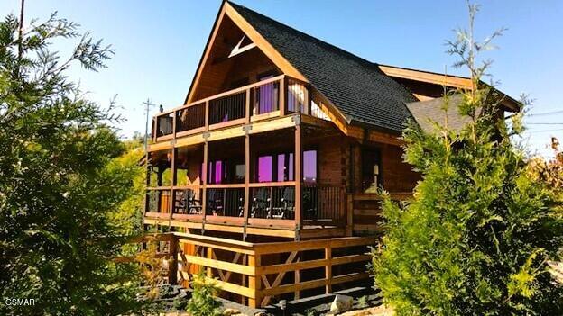 710 Village Loop Rd, Gatlinburg, TN 37738 - back of property featuring a shingled roof and a balcony
