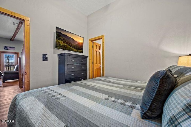 bedroom featuring wood finished floors