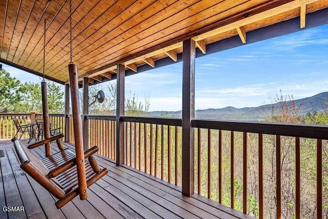 wooden deck featuring a mountain view