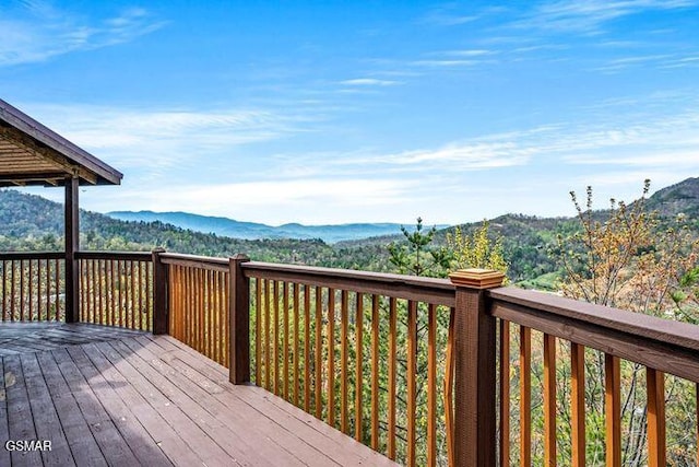 wooden deck featuring a mountain view