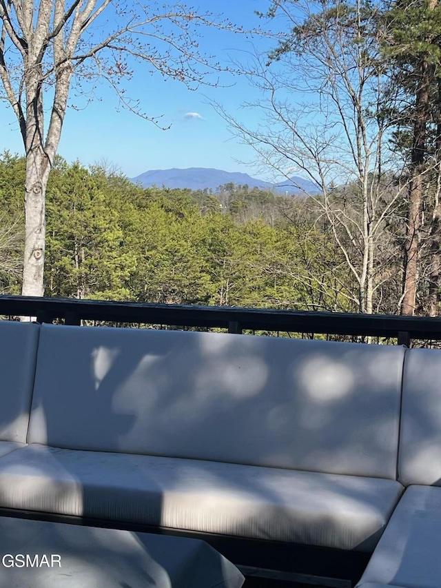 exterior space featuring a view of trees